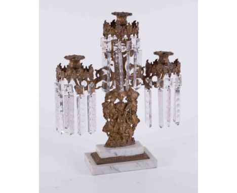 A 19th Century gilt metal candelabra with glass lustre drops on a stepped marble base, height 43cm.