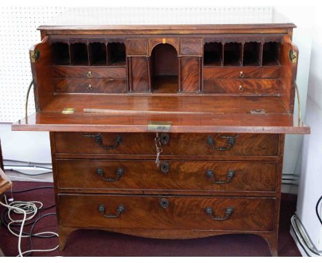 A Georgian mahogany secretaire chest, the upper drawer with a fitted interior over four long graduated drawers on splayed bra