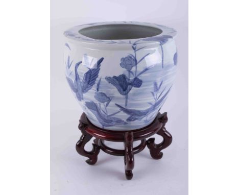 A large 20th century Chinese blue and white planter on stand, height 30cm.