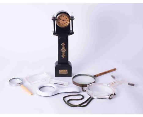 A mini Longcase clock together with five magnifying glasses.