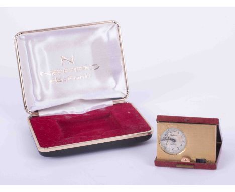 A Nepro electronic miniature travel alarm clock, cased.