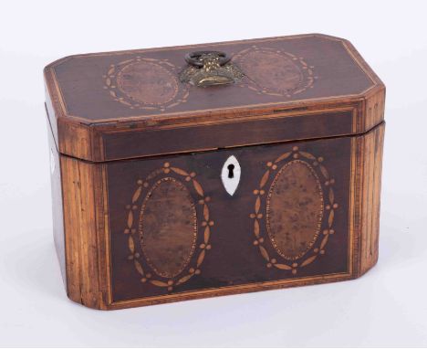 A 19th Century mahogany and inlaid tea caddy with panels of burr walnut, gilt metal finial, height 12cm and width 19cm.