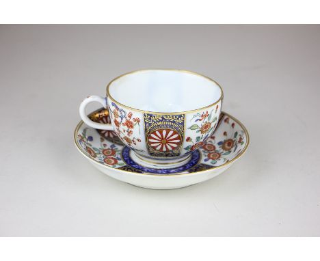 A 19th century Royal Worcester teacup and saucer with Japanese style decoration, with rare mark to base (a/f - restored)