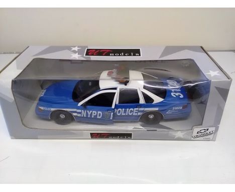 Chevrolet Caprise Die cast 1:18 scale model police car. UT Models series. In original box in good condition.