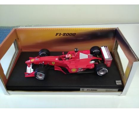 Michael Schumacher signed plaque with Ferrari F1-2000 Michael Schumacher Die cast 1:18 scale model Formula One racing car. Ho