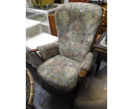A mid 20th century dark Ercol stick back armchair 