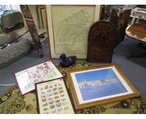 A selection of mixed framed and glazed pictures to include cigarette cards, a Butchers advertisement sign, a landscape print,