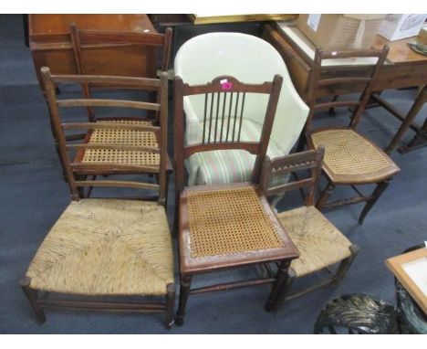 A selection of early 20th century chairs to include a Lloyd Loom chair, oak ladder backs and others 