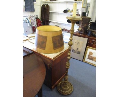 A late 19th/early 20th century Italianate carved gilt wood standard lamp with parchment shade 
