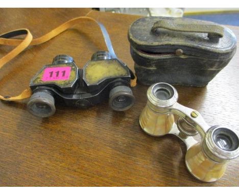 A pair of Negretti & Zambra binoculars, together with a pair of mother of pearl opera glasses, cased 