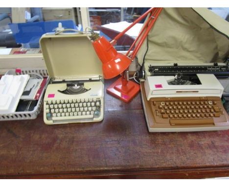 A Smith-Corona electric typewriter with accessories, an Olympia Splendid 66 manual typewriter and an anglepoise lamp 