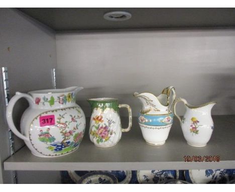 Four 19th/20th century jugs, each decorated with flowers, comprising Dresden, Spode, Copenhagen and Staffordshire, largest 5 