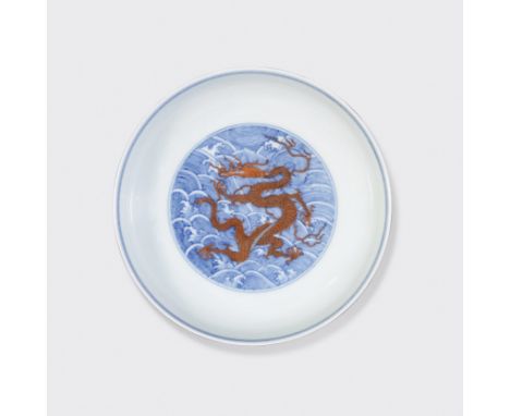 An underglaze blue and iron red dragon dishQianlong Mark, 19th centuryDecorated across the floor of the well with a five-claw