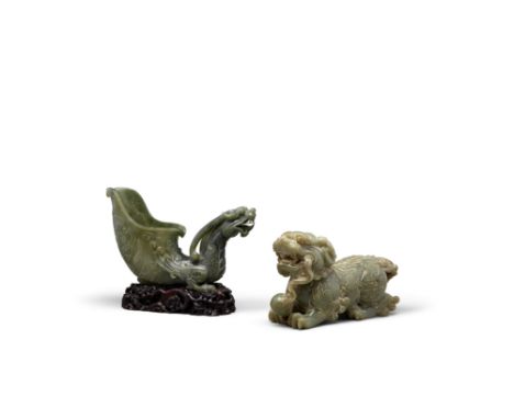 TWO GREEN JADE MYTHICAL BEAST CARVINGSThe first a fanciful rhyton cup of pale spinach green hue, the thinly polished walls is