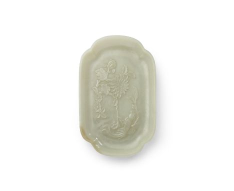 A carved jade lobed dishOf elongated quadrilobate shape displaying sharply carved bird and flower decoration to the flat well