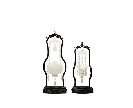 TWO WHITE JADE HANGING ORNAMENTSThe first formed as a reticulated hexagonal hanging lantern with separately carved cover, the