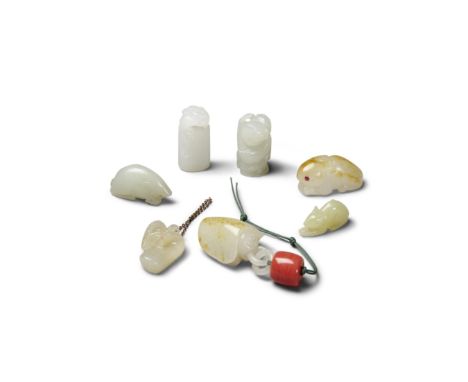 Seven small jade carvingsAll the tiny pebbles formed from off-white jade tinged in varied hues ranging from green to gray to 