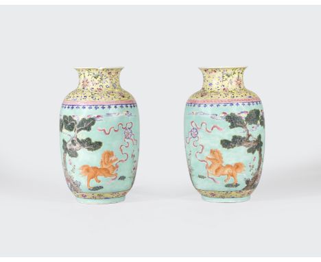 A pair of turquoise ground famille rose enameled vasesJiaqing marks, late Qing/Republic periodThe waisted necks covered in vi