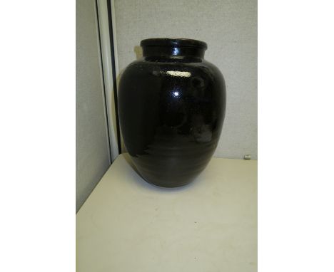 A group of four decorationsThe first a black glazed stoneware ovoid storage jar  (minor chips); the second a Shiwan pottery g