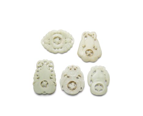 Five jade pendants with movable medallionsThe first of two butterflies facing a bi-disc surrounding a four-petal flower medal