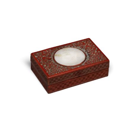 A cinnabar lacquer rectangular box mounted with a jade plaqueThe box sides carved in relief with a diamond-diaper pattern tha