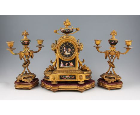 A 19th Century gilt metal clock garniture comprising of clock with a pair of twin branch candle holders, all having ornate de
