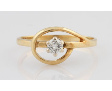 An 18ct yellow gold diamond solitaire ring, set with a central round brilliant cut diamond, approx. 0.16ct, with open metalwo