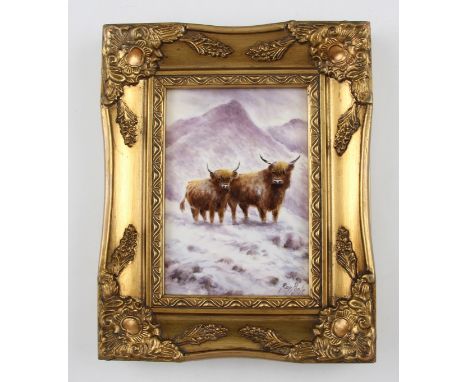 A hand painted porcelain plaque by ex-Worcester artist Ray Poole, depicting two highland cattle in a snowy winter mountain sc