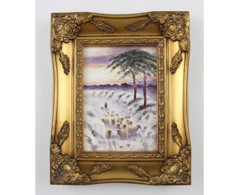 A hand painted porcelain plaque by ex-Worcester artist Ray Poole, depicting a shepherd with sheep on a snowy winter scene, si