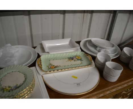 Two white glazed cake stands; four white glazed ramekins; A Royal Worcester cake plate etc,.