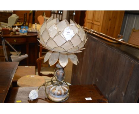 A gilded table lamp and shade