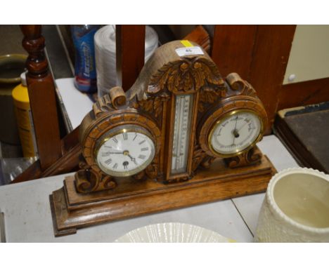 A carved oak clock; barometer and thermometer set