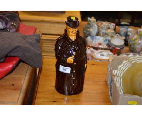 A Continental treacle glazed decanter and stopper in the form of a gentleman wearing a cloak
