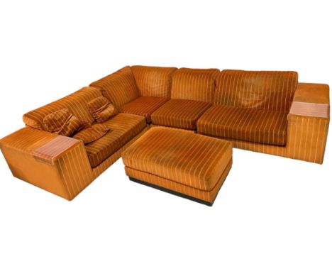 HOWARD KEITH: A LARGE SECTIONAL CORNER SOFA UPHOLSTERED IN STRIPED BURNT ORANGE FABRIC, 300cm x 240cm x 70cm Raised on castor