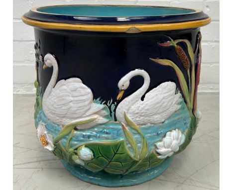 A GEORGE JONES MAJOLICA JARDINIERE DECORATED WITH SWANS, 37cm x 30cm 