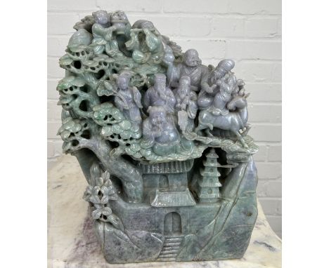 A LARGE AND EXCEPTIONALLY HEAVY CHINESE GREEN AND PURPLE JADE SCULPTURE DEPICTING SEVERAL FIGURES WITH FOLIAGE AND PAGODA, 42