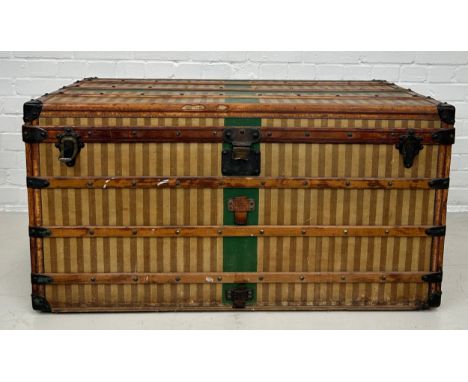 A 19TH CENTURY LOUIS VUITTON TRUNK CIRCA 1885, Brown striped design with leather details and green painted cross. Labelled 'N