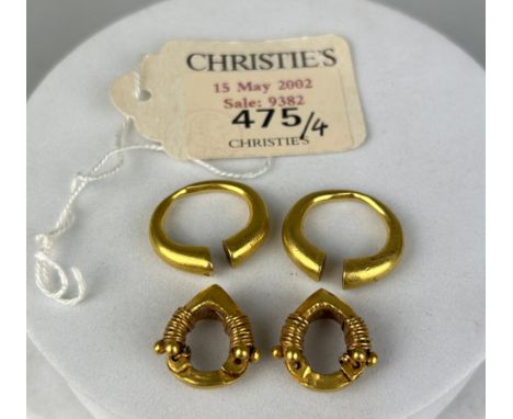 A PAIR OF PARTHIAN GOLD EARRINGS CIRCA 2ND CENTURY B.C. / A.D. ALONG WITH A PAIR OF WESTERN ASIATIC GOLD PENANNULAR HOOP EARR