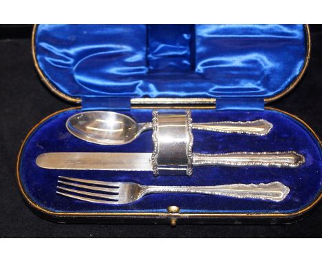 Sterling silver knife, fork and spoon set with napkin