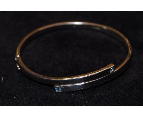 9ct white gold bangle, set with two blue stones 6.8 grams