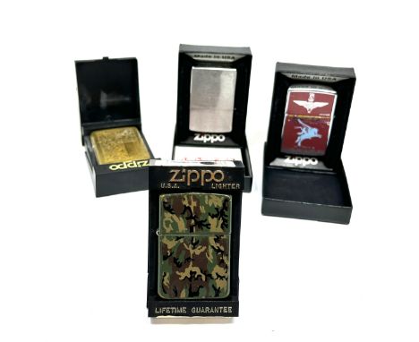 4 boxed vintage Zippo lighters 