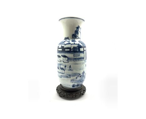 20th century Chinese blue and white vase decorated with a scene of figures in a courtyard setting, Kangxi mark beneath, on st