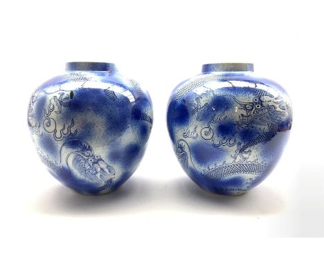 Pair of Chinese blue and white ginger jars painted with Dragons on splatter effect ground,  seal mark to base, H24cm 