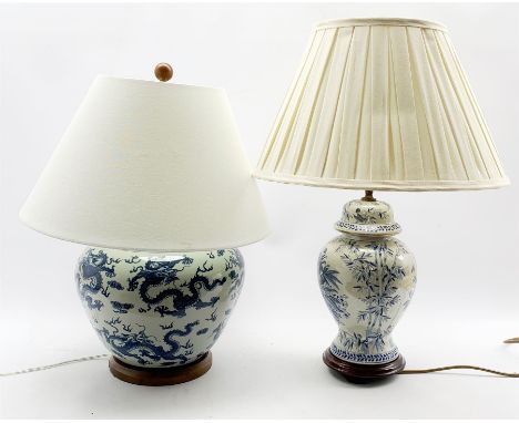 Ralph Lauren porcelain table lamp decorated in blue and white with Chinoiserie design, with shade, and a similar style orient