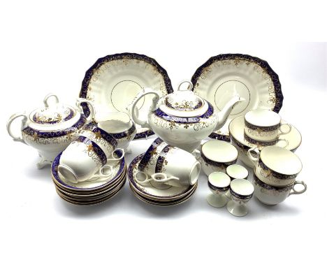 19th century English porcelain tea set, decorated with gilt sprigs of grape and vine and with cobalt blue bands, comprising t