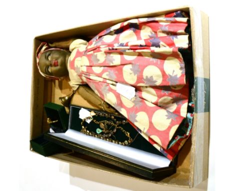 A gem set ring stamped '585', a gilt metal paste set enamel decorated necklace, a seal fob and an upside down doll 