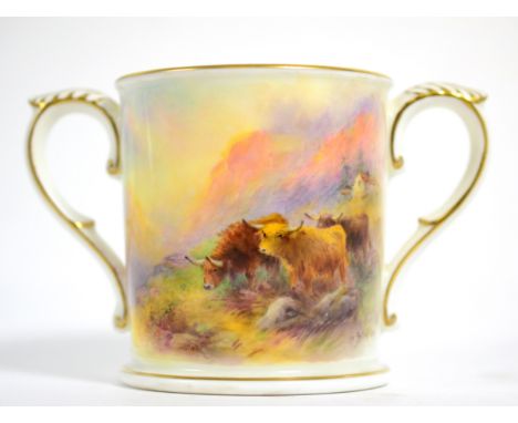 A Royal Worcester loving cup painted by H Stinton decorated with highland cattle 