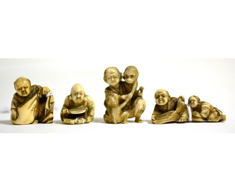 Four Japanese Meiji period netsuke comprising a man with two monkeys, 4cm in height; with a figural group and two single figu
