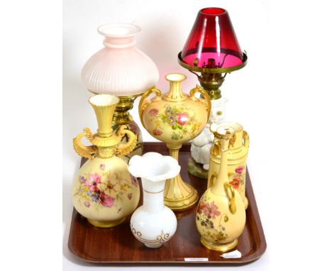 Four pieces of Royal Worcester blush ivory (a.f.), two small oil lamps, one with cat form base and a glass shade