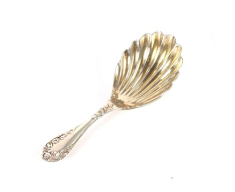 A late Victorian silver caddy spoon, having shell shaped bowl and foliate embossed handle, Birmingham 1900
